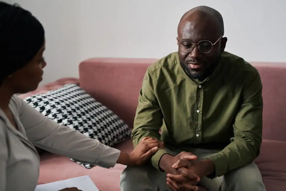 man with anxiety in therapy